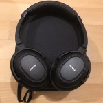 Photo of MPow H8 Bluetooth headphones on top of carrying case